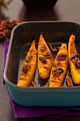 Baked pumpkin wedges with walnuts and cinnamon