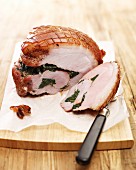 Roast ham stuffed with spinach, sliced