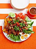 Satay chicken drumettes with vegetable