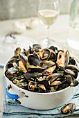 Mussels in a white wine broth with garlic and herbs
