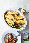 Kale with chickpeas and grilled bread served with salsiccia meatballs