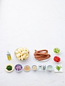 Ingredients or potato salad with sausages