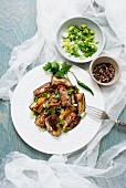 Fried aubergines with chilli and spring onions