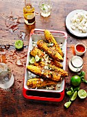 Elotes, grilled Mexican corncobs with feta cheese