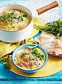 Spicy rice soup with puri bread