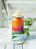 Rainbow cake in a glass as a gift