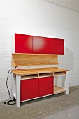 DIY workbench with red cupboard doors