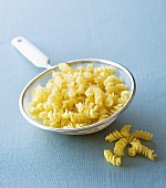 Fusilli in a sieve