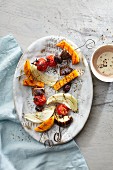 Grilled aubergine and butternut squash skewers with onions, tahini and za'atar