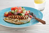 Grilled chicken breast with a watermelon and cucumber salad
