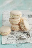 Vanilla macaroons on an old piece of writing