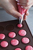Marbled macaroons with cherries being made