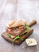 A sandwich with beef fillet and caramelised onions