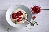 Semolina pudding with raspberries and pistachio nuts