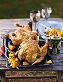Beer-can chicken with pineapple skewers
