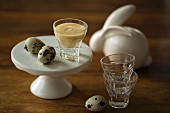 Eggnog with tonka beans garnished with quail's eggs for Easter