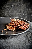 Caramel and chocolate brittle on a plate
