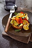 Oven baked potato with grilled vegetables and rosemary