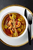 Clear prawn soup with tomatoes, fennel seeds and lemongrass