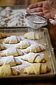 Rugelach or Rogaliki (Russian jam pastries) on a baking tray