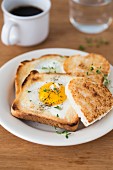 A heart-shaped fried egg in a slice of a toast