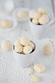 Coconut truffles in a white cup