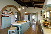 Large, country-house-style Mediterranean kitchen with terracotta floor tiles