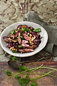 Aubergine salad with lamb and red onions
