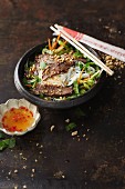 Thai beef salad with rice noodles and peanuts