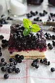 A slice of wild blueberry sponge cake
