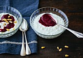 Cream cheese yoghurt with berry purée and pine nuts