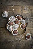Chocolate spread truffles with cocoa powder and grated coconut