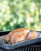 A spring chicken on a barbecue
