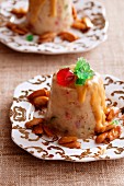 Chipotle pudding with candied fruits and almonds