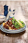 Chilli con carne with steak, nachos and avocado