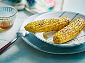 Grilled corn cobs in a rum marinade