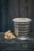 Waxed wood wool as a fire lighter and a sand bucket for extinguishing