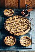 A giant chocolate chunk toffee cookie with smaller ones