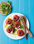Oven-roasted tomatoes filled with mozzarella