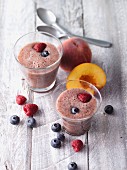 Blueberry and peach smoothies with raspberries and yacon syrup