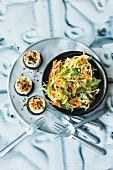 White cabbage and carrot salad with pumpernickel and cheese bites