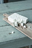 Feta cheese on a chopping board