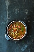 Puy lentil soup with miso paste and watermelon