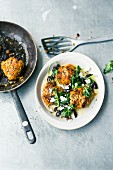 Sweet potato fritters with goat's cheese, black olives and rocket butter