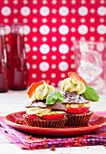 Strawberry and chocolate cupcakes with a lime and basil topping