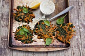 Vegetarian carrot and spinach fritters with a lemon dip