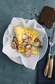 An omelette with radishes and cress