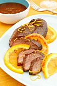 Fried duck breast with orange sauce