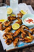 Glazed chicken wings with yoghurt sauce and lemon