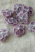 Violet sweets on a linen cloth